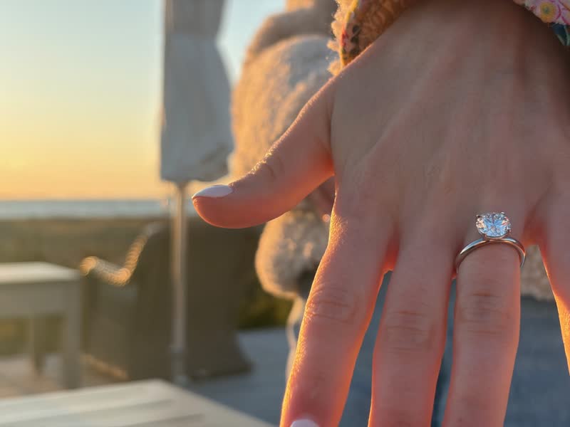 Engagement ring close-up at sunset